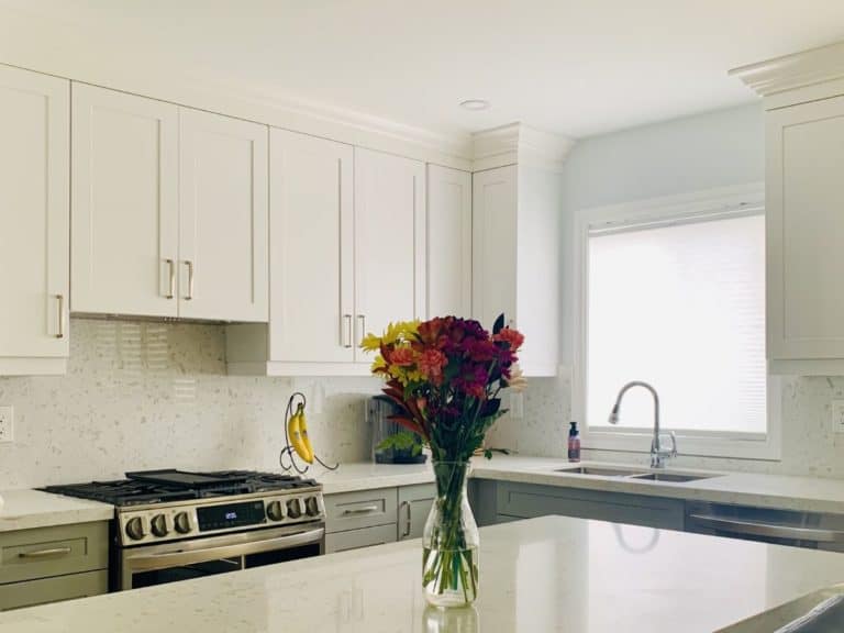 after kitchen reno white gray cabinets quartzcounter island pot lights caledon adept services