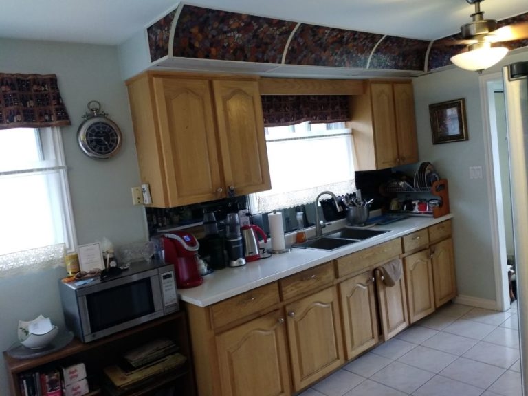 before kitchen renovation dated cabinets bulkhead tiles mississauga adept services