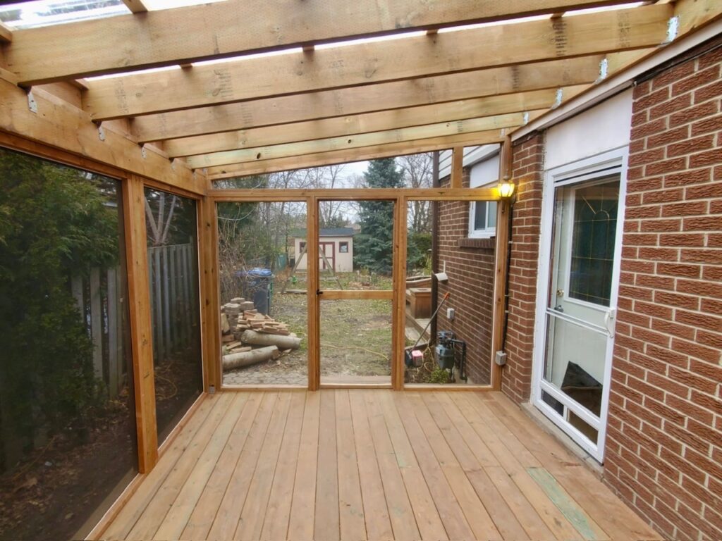 screened in covered porch wood deck roof panels polycarbonate renovation build Adept Services contractor Brampton GTA